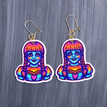 Neon Doll Earrings. These earrings are made with acrylic and hand heat pressed. Comes with 18k plated gold hooks that is nickel free. Easily put loop through ear and hook back so the earring doesn’t fall out.