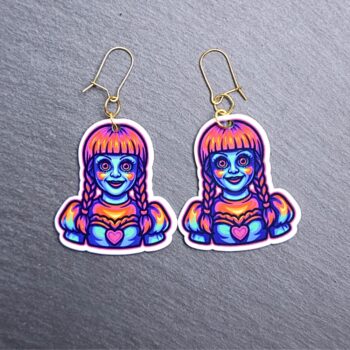 Neon Doll Earrings. These earrings are made with acrylic and hand heat pressed. Comes with 18k plated gold hooks that is nickel free. Easily put loop through ear and hook back so the earring doesn’t fall out.