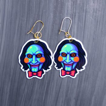 Neon Puppet Earrings. These earrings are made with acrylic and hand heat pressed. Comes with 18k plated gold hooks that is nickel free. Easily put loop through ear and hook back so the earring doesn’t fall out.