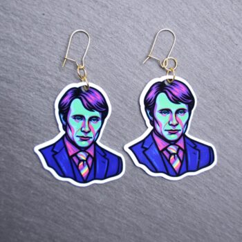 Neon To Eat The Rude Earrings. These earrings are made with acrylic and hand heat pressed. Comes with 18k plated gold hooks that is nickel free. Easily put loop through ear and hook back so the earring doesn’t fall out.