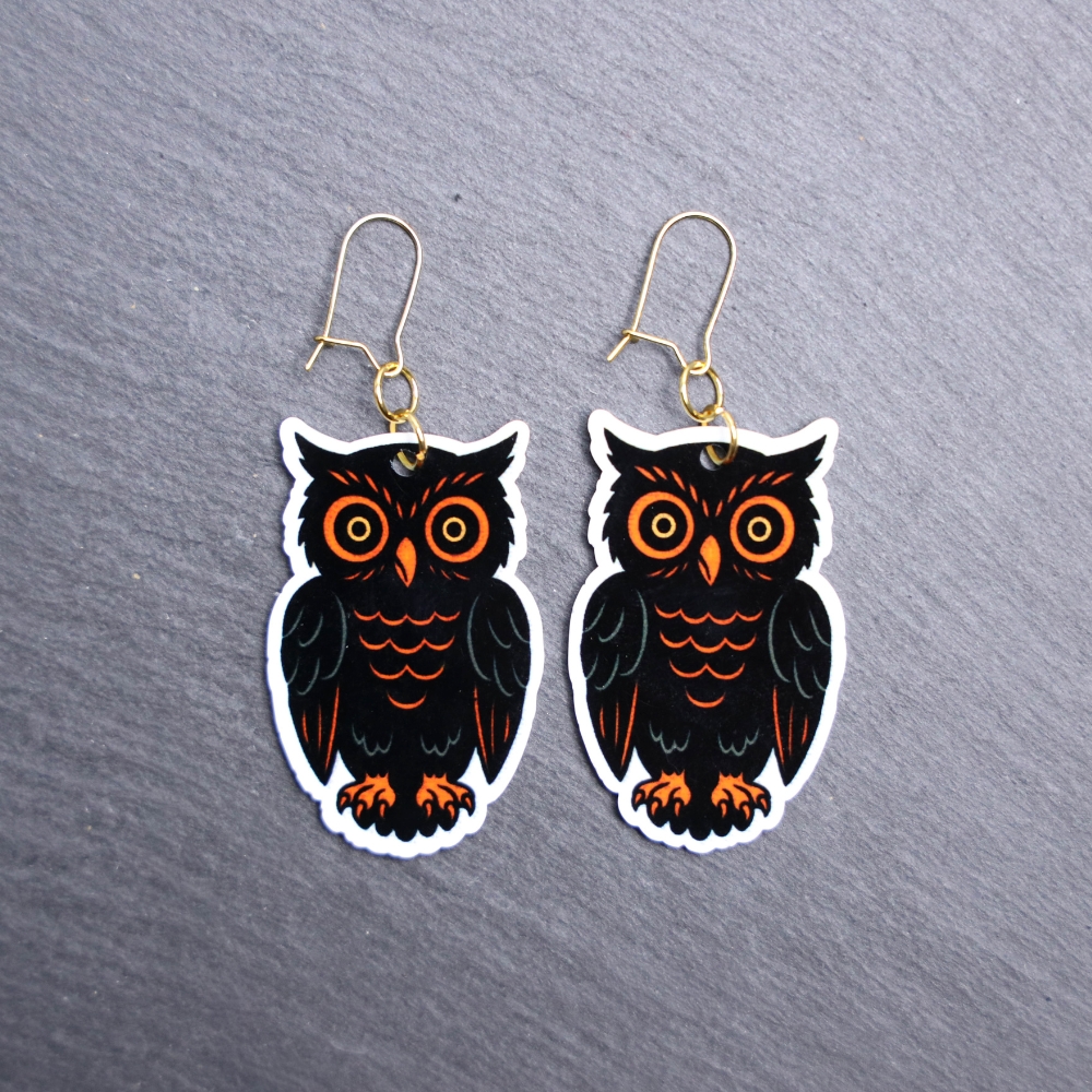 Vintage Owl Earrings. These earrings are made with acrylic and hand heat pressed. Comes with 18k plated gold hooks that is nickel free. Easily put loop through ear and hook back so the earring doesn’t fall out.