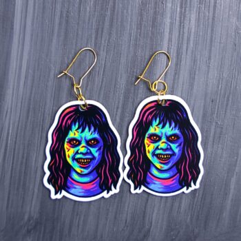 Neon Demon Girl Earrings. These earrings are made with acrylic and hand heat pressed. Comes with 18k plated gold hooks that is nickel free. Easily put loop through ear and hook back so the earring doesn’t fall out.