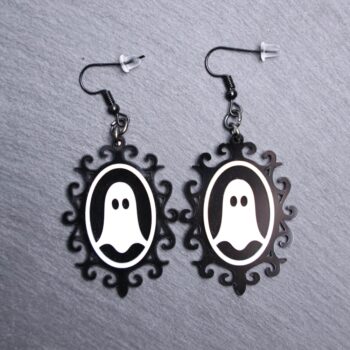 Ghost Vintage Frame Earrings. These earrings are made with black and white acrylic. Comes with black hooks that is nickel free.
