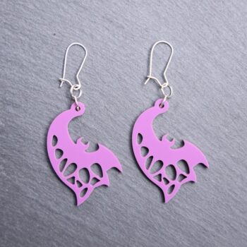 Bat Sideways Purple Earrings. These earrings are made with purple acrylic. Comes with silver hooks that is nickel free.