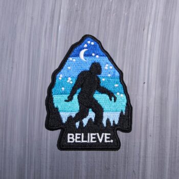 Bigfoot Arrowhead Believe Patch in black, blue, and with a moon. Beautifully embroidered design with an adhesive for easy application to your favorite bag or article of clothing.