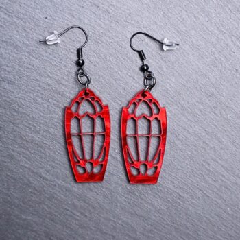 Dracula's Window Earrings. These earrings are made with pearl red acrylic. Comes with black hooks that is nickel free.