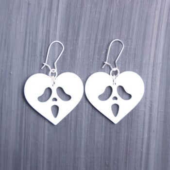 Ghostface Heart Earrings. These earrings are made with white acrylic. Comes with silver hooks that is nickel free.