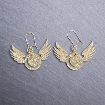 Golden Snitch Glitter Earrings. These earrings are made with gold glitter acrylic. Comes with gold hooks that is nickel free.