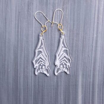 Hanging Bat Clear Earrings. These earrings are made with clear acrylic. Comes with gold hooks that is nickel free.