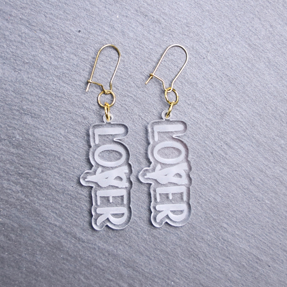 Loser Lover Clear Earrings. These earrings are made with clear acrylic. Comes with gold hooks that is nickel free.