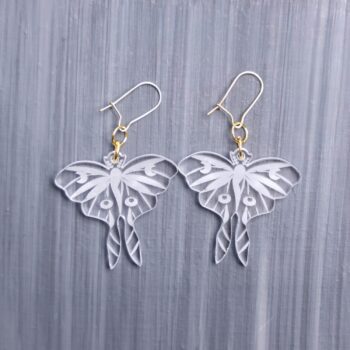 Luna Moth Clear Earrings. These earrings are made with clear acrylic. Comes with gold hooks that is nickel free.