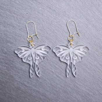 Luna Moth Clear Earrings. These earrings are made with clear acrylic. Comes with gold hooks that is nickel free.