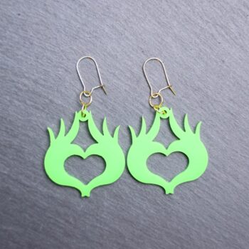 Mean One Heart Earrings. These earrings are made with green acrylic. Comes with gold hooks that is nickel free.