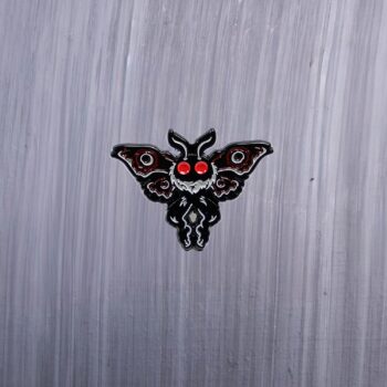 Mothman Detailed Enamel Pin in gray, red, and black. These enamel pins are made with metal. These enamel pins are colorful, with a black backing.