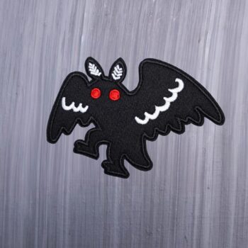 Mothman Walking Patch in white and black with red eyes. Beautifully embroidered design with an adhesive for easy application to your favorite bag or article of clothing.