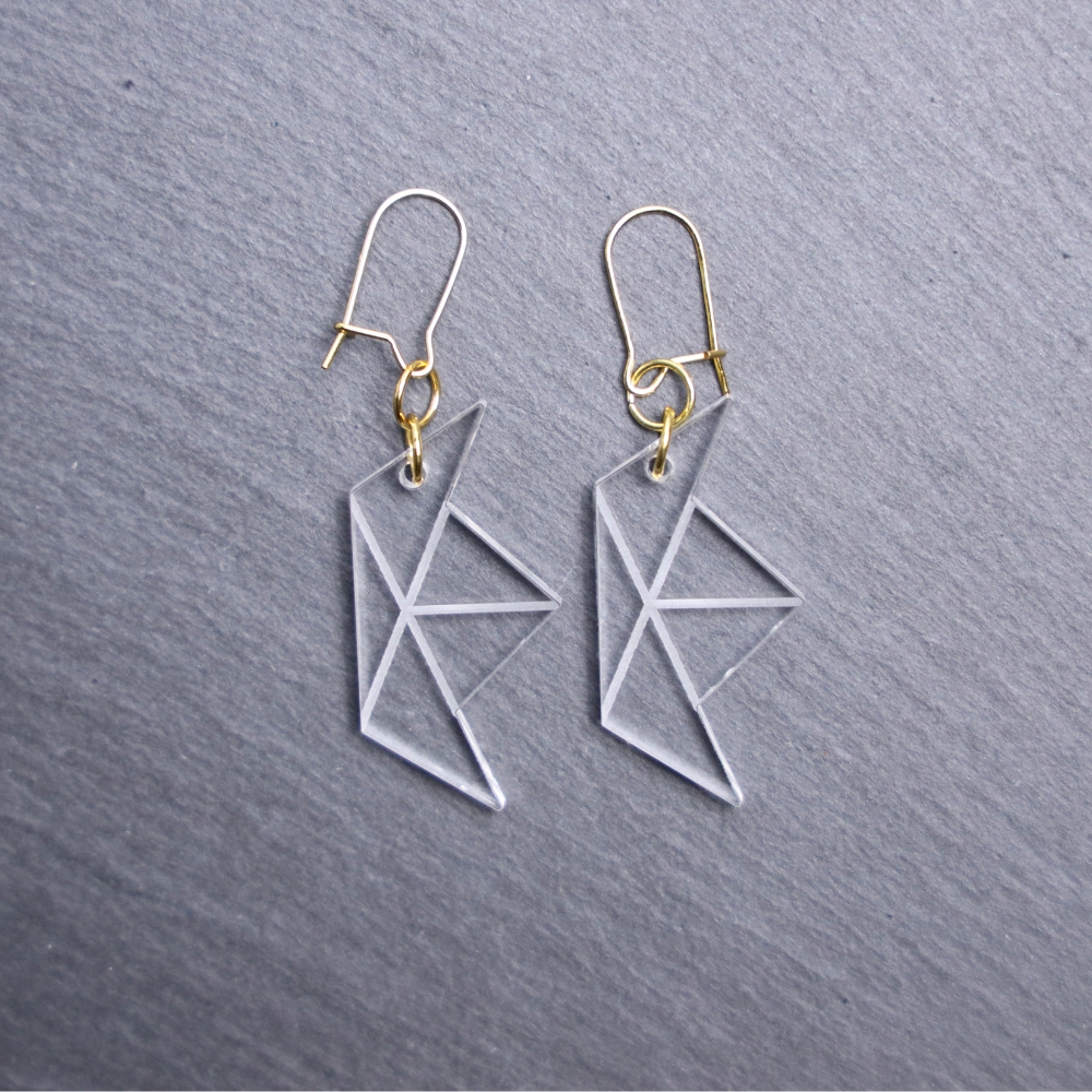 Paper Boat Clear Earrings. These earrings are made with clear acrylic. Comes with gold hooks that is nickel free.