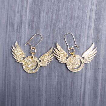 Golden Snitch Glitter Earrings. These earrings are made with gold glitter acrylic. Comes with gold hooks that is nickel free.