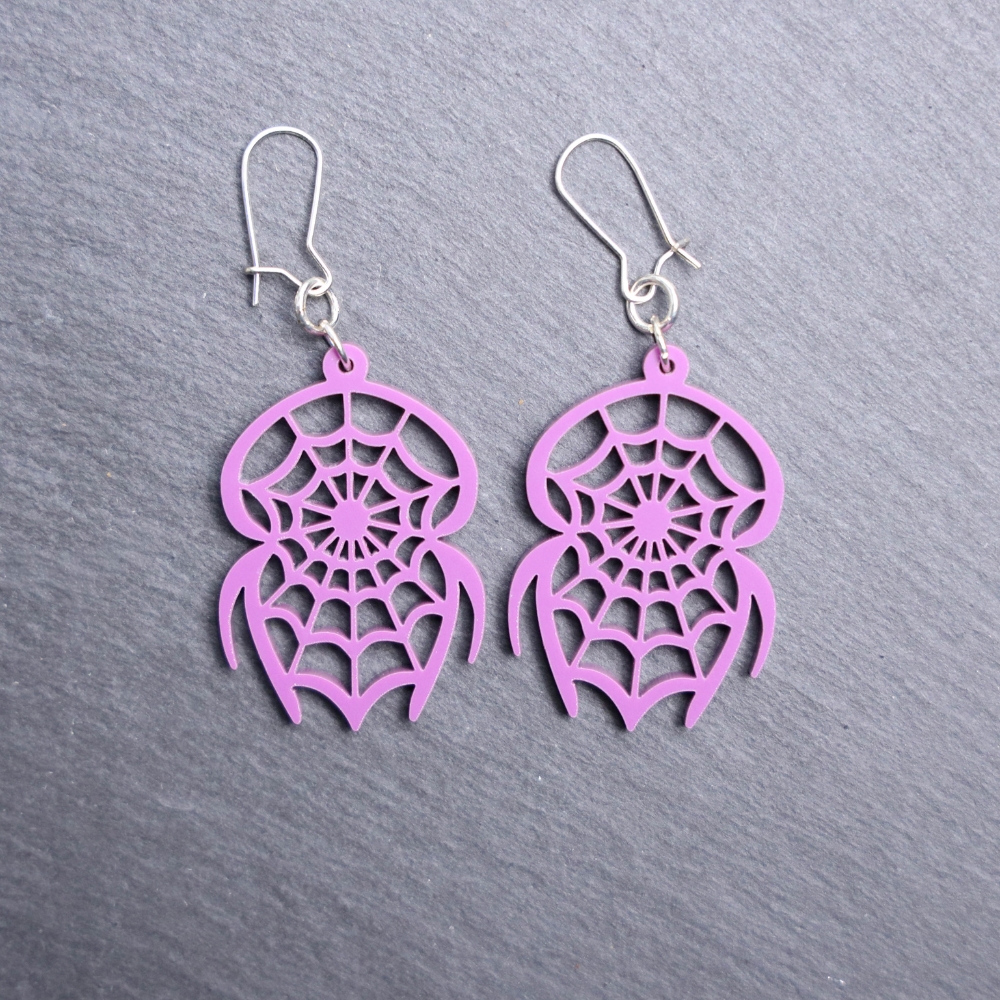 Spider Catcher Purple Earrings. These earrings are made with purple acrylic. Comes with silver hooks that is nickel free.