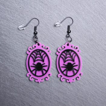 Spider Frame Earrings. These earrings are made with purple and black acrylic. Comes with black hooks that is nickel free.
