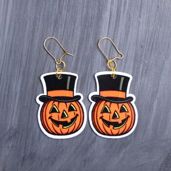 Vintage Jack Earrings. These earrings are made with acrylic and hand heat pressed. Comes with 18k plated gold hooks that is nickel free. Easily put loop through ear and hook back so the earring doesn’t fall out.