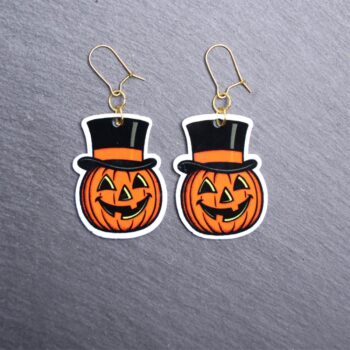 Vintage Jack Earrings. These earrings are made with acrylic and hand heat pressed. Comes with 18k plated gold hooks that is nickel free. Easily put loop through ear and hook back so the earring doesn’t fall out.