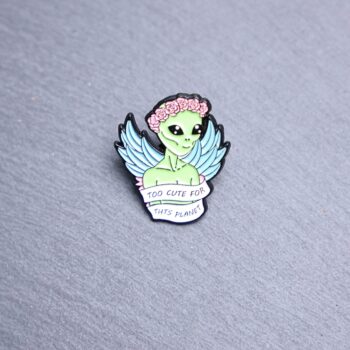 Alien Too Cute For This Planet Enamel Pin with green and pink roses. These enamel pins are made with metal. These enamel pins are colorful, with a black backing.