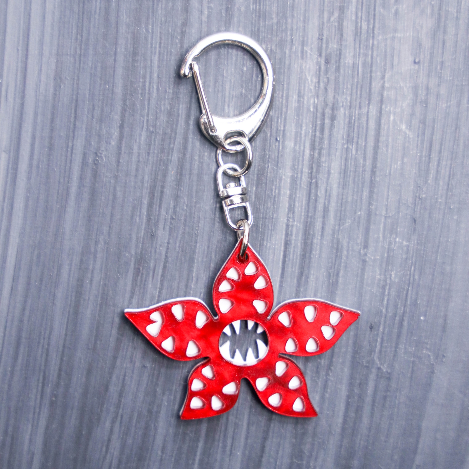 Demogorgon Bag Tag. Red pearl and white acrylic designed charm with a swivel lobster snap hook in high quality metal alloy.