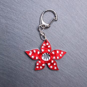 Demogorgon Bag Tag. Red pearl and white acrylic designed charm with a swivel lobster snap hook in high quality metal alloy.