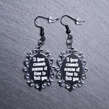 Crossed Oceans Of Time Earrings. These earrings are made with black to white acrylic. Comes with black hooks that is nickel free.