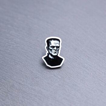 Frank Acrylic Pin. These acrylic pins are made with cast acrylic. These pins are colorful, with a black pin back.