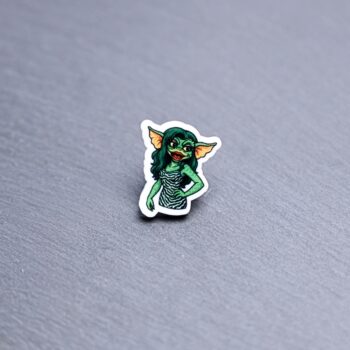 Greta Acrylic Pin. These acrylic pins are made with cast acrylic. These pins are colorful, with a black pin back.