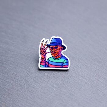 Neon Dream Demon Acrylic Pin. These acrylic pins are made with cast acrylic. These pins are colorful, with a black pin back.