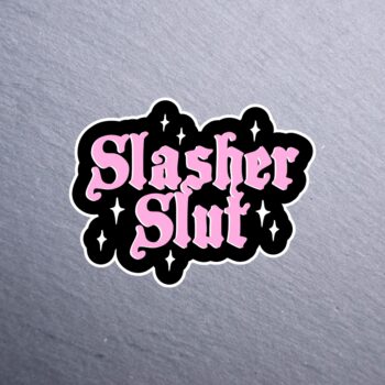 Slasher Slut Sticker. These stickers are made with printable vinyl with a vinyl top coat that is scratch-resistant and water resistant.