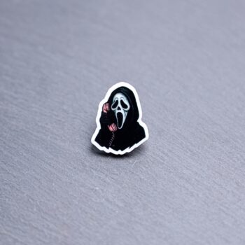 The Voice Knife Acrylic Pin. These acrylic pins are made with cast acrylic. These pins are colorful, with a black pin back.