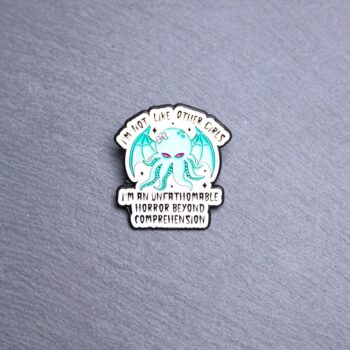 I'm Not Like Other Girls Cthulhu Enamel Pin. These enamel pins are made with metal. These enamel pins are colorful, with a black backing.