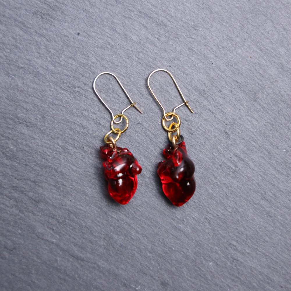 Anatomical Heart 3D Earrings. These earrings are made with clear acrylic. Deep red coloring. Comes with gold hooks that is nickel free.