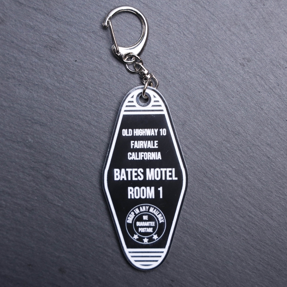 Bates Motel Movie Bag Tag. This bag tag is made with engraved acrylic. Comes with lobster clasp topper that easily hooks to a bag, zippers, keychains,