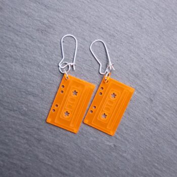 Cassette Neon Orange Earrings that are translucent. These earrings are made with clear acrylic. Comes with sliver hooks that is nickel free.