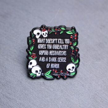 Dark Sense Of Humor Enamel Pin. These enamel pins are made with metal. These enamel pins are colorful, with a black backing.