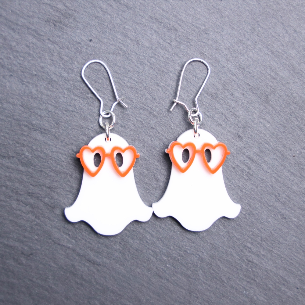 Ghost Heart Glasses Earrings that are white and orange. These earrings are made with white and orange acrylic. Comes with silver hooks that is nickel free.
