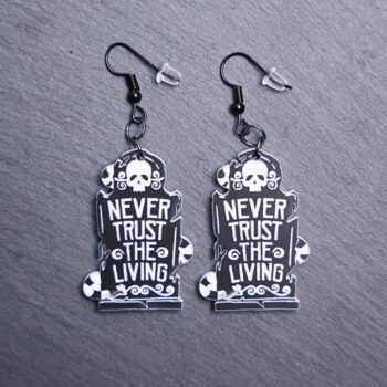 Never Trust The Living Earrings that are white and black. These earrings are made with engraved acrylic. Comes with black hooks that is nickel free.