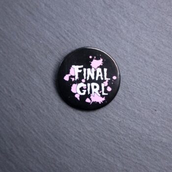 Final Girl Pink Button. These buttons are made with photo paper, metal round, and metal backing. These buttons are vibrant and fun to use on bags or vests.