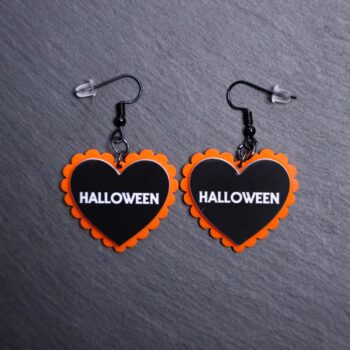 Halloween Pillow Earrings that are white, black and orange. These earrings are made with engraved acrylic. Comes with black hooks that is nickel free.