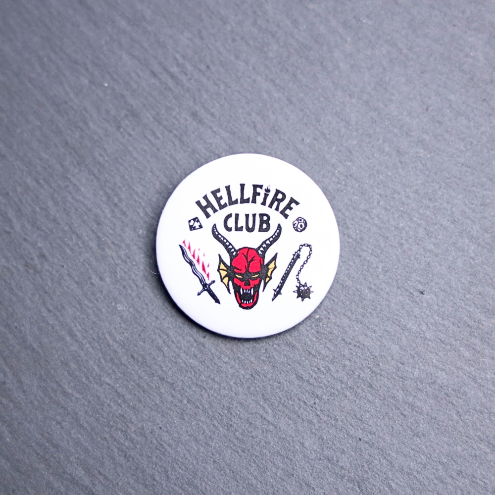 Hellfire Button. These buttons are made with photo paper, metal round, and metal backing. These buttons are vibrant and fun to use on bags or vests.