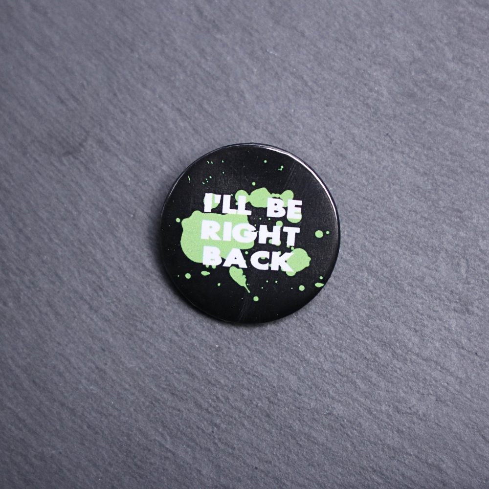 I'll Be Right Back Button. These buttons are made with photo paper, metal round, and metal backing. These buttons are vibrant and fun to use on bags or vests.