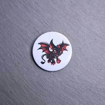 Jersey Devil Button. These buttons are made with photo paper, metal round, and metal backing. These buttons are vibrant and fun to use on bags or vests.
