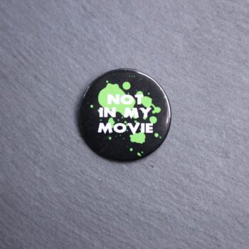 Not In My Movie Button. These buttons are made with photo paper, metal round, and metal backing. These buttons are vibrant and fun to use on bags or vests.
