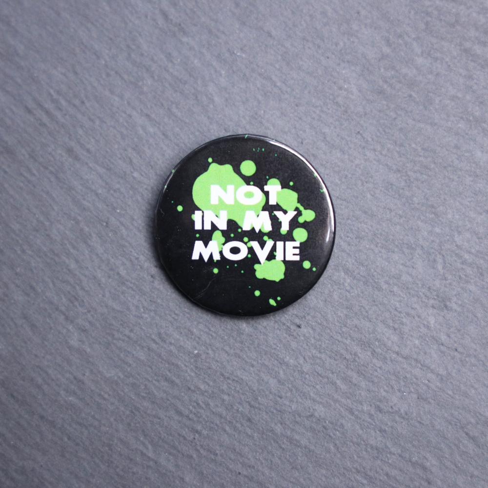 Not In My Movie Button. These buttons are made with photo paper, metal round, and metal backing. These buttons are vibrant and fun to use on bags or vests.