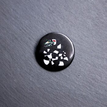 Sandworm Button. These buttons are made with photo paper, metal round, and metal backing. These buttons are vibrant and fun to use on bags or vests.