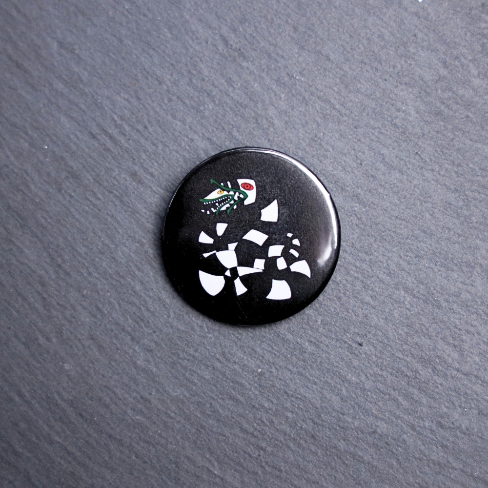 Sandworm Button. These buttons are made with photo paper, metal round, and metal backing. These buttons are vibrant and fun to use on bags or vests.